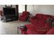 Comfortable living room featuring a large television and red seating at 3805 Vidalia Ave, North Las Vegas, NV 89031