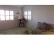 Inviting living room featuring large windows with shutters and cozy seating at 3805 Vidalia Ave, North Las Vegas, NV 89031