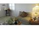 Comfortable living room with a plush loveseat, table lamps and decorative accents at 3805 Vidalia Ave, North Las Vegas, NV 89031