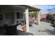 Charming covered patio with elegant outdoor furniture and well-maintained landscaping at 3805 Vidalia Ave, North Las Vegas, NV 89031
