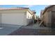 This home has a two car garage and a side yard at 3805 Vidalia Ave, North Las Vegas, NV 89031