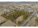 Overhead angle of home with tall surrounding trees in a desert neighborhood near open land and mountains at 4021 Jesse St, Pahrump, NV 89048