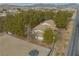 Scenic aerial view of a home and property surrounded by trees at 4021 Jesse St, Pahrump, NV 89048