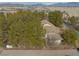 Scenic aerial view of a home and property surrounded by trees at 4021 Jesse St, Pahrump, NV 89048