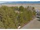 Overhead shot featuring a home among trees, near a street in a rural area, with a distant mountain view at 4021 Jesse St, Pahrump, NV 89048