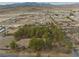 Expansive aerial view of a home surrounded by mature trees in a rural neighborhood near desert mountains at 4021 Jesse St, Pahrump, NV 89048