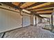 View of a sprawling brick back patio featuring exposed beams, lighting, and access to the yard at 4021 Jesse St, Pahrump, NV 89048