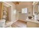 Bathroom features a shower, sink, toilet, and a water heater at 4021 Jesse St, Pahrump, NV 89048