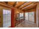 Unique bathroom featuring brick flooring, exposed wood beams, and glass bowl sinks at 4021 Jesse St, Pahrump, NV 89048