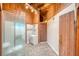 Bathroom with exposed wood beams, a glass shower, and modern fixtures at 4021 Jesse St, Pahrump, NV 89048