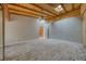 A light-filled bedroom featuring brick floors, a vaulted wood ceiling with skylight, and neutral walls at 4021 Jesse St, Pahrump, NV 89048