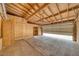 Unfinished garage with plywood walls and ceiling at 4021 Jesse St, Pahrump, NV 89048