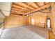 Unfinished garage with plywood walls and ceiling at 4021 Jesse St, Pahrump, NV 89048