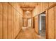 Charming hallway features brick flooring, wood-paneled walls, and decorative lighting at 4021 Jesse St, Pahrump, NV 89048