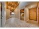 Hallway features unique brick flooring, wood paneling, and skylights for natural light at 4021 Jesse St, Pahrump, NV 89048