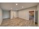 Large living room with hardwood flooring, grey walls, and recessed lighting at 4021 Jesse St, Pahrump, NV 89048