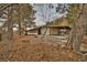 Unique single-story home featuring a long covered patio, surrounded by natural desert foliage at 4021 Jesse St, Pahrump, NV 89048