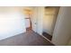 Bedroom with plush carpet, closet space and an entrance to another room at 4712 Primavera St, Las Vegas, NV 89122