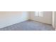 Large bedroom with plush carpet and a window offers plenty of space at 4712 Primavera St, Las Vegas, NV 89122