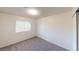 Bright bedroom with plush carpet features a window for natural light and closet at 4712 Primavera St, Las Vegas, NV 89122