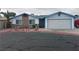 Charming single-story home with a stone accent wall and a two-car garage at 4712 Primavera St, Las Vegas, NV 89122