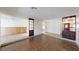 Open living space showcasing tile and wood-look floors, partial walls with kitchen view at 4712 Primavera St, Las Vegas, NV 89122