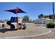 Neighborhood park offers a playground including swings, slides, and play equipment, ideal for and families at 4712 Primavera St, Las Vegas, NV 89122