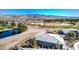 Aerial view of the home and community, highlighting the serene golf course and pond setting at 4924 E Cactus Canyon Dr, Pahrump, NV 89061