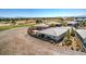 Scenic aerial shot of the home with a golf course backdrop and views of pond, and surrounding community at 4924 E Cactus Canyon Dr, Pahrump, NV 89061