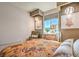 Serene bedroom featuring stylish decor, a comfy bed, and a window with scenic views, perfect for relaxation at 4924 E Cactus Canyon Dr, Pahrump, NV 89061
