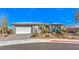 Charming single-story home with desert landscaping, mountain views, and a spacious two-car garage at 4924 E Cactus Canyon Dr, Pahrump, NV 89061