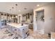 Modern kitchen featuring a large island, stainless steel appliances, and sleek gray cabinetry at 4924 E Cactus Canyon Dr, Pahrump, NV 89061