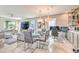 Open-concept living space featuring a dining area, comfortable seating, and natural light at 4924 E Cactus Canyon Dr, Pahrump, NV 89061