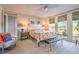 Bright main bedroom featuring large windows, plush carpeting, and stylish furnishings at 4924 E Cactus Canyon Dr, Pahrump, NV 89061