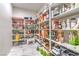 Well-stocked pantry with ample shelving and organized storage solutions on marble flooring at 4924 E Cactus Canyon Dr, Pahrump, NV 89061