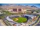 Spectacular aerial view of the baseball stadium and surrounding buildings with a mountain backdrop at 5109 Sugarfoot Ave, Las Vegas, NV 89107