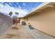 Backyard features block walls, mature trees and an outdoor work area at 5109 Sugarfoot Ave, Las Vegas, NV 89107