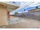Large, empty backyard featuring a concrete patio, block wall, and space for outdoor living at 5109 Sugarfoot Ave, Las Vegas, NV 89107