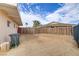 Spacious backyard with a wooden fence, perfect for outdoor activities at 5109 Sugarfoot Ave, Las Vegas, NV 89107