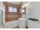 Bathroom showing the shower/tub and vanity with tile and decorative accents at 5109 Sugarfoot Ave, Las Vegas, NV 89107