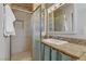 Stylish bathroom highlighting the glass shower door and a sink vanity featuring a granite countertop at 5109 Sugarfoot Ave, Las Vegas, NV 89107