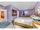 Cozy bedroom featuring a wooden bed frame, soft lighting, and carpet floors at 5109 Sugarfoot Ave, Las Vegas, NV 89107