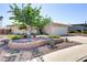 Charming single-story home with a well-maintained front yard, mature tree, and low brick wall landscaping at 5109 Sugarfoot Ave, Las Vegas, NV 89107