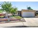 Charming single-story home with a well-manicured yard and colorful flower beds at 5109 Sugarfoot Ave, Las Vegas, NV 89107