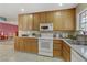 Bright kitchen with tiled floors, updated appliances, ample counter and cabinet space at 5109 Sugarfoot Ave, Las Vegas, NV 89107
