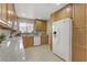 Bright kitchen with tiled floors, updated appliances, and ample cabinet space at 5109 Sugarfoot Ave, Las Vegas, NV 89107