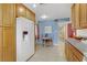 Bright kitchen with tiled floors, updated appliances, ample counter and cabinet space and dining table at 5109 Sugarfoot Ave, Las Vegas, NV 89107