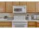 Bright kitchen featuring light-colored cabinets, updated appliances, and ample counter space at 5109 Sugarfoot Ave, Las Vegas, NV 89107