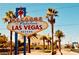 Iconic 'Welcome to Fabulous Las Vegas' sign surrounded by palm trees and a clear blue sky at 5109 Sugarfoot Ave, Las Vegas, NV 89107