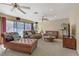 Inviting living room with carpet floors, fireplace, neutral colors, sliding glass doors and comfortable furnishings at 5109 Sugarfoot Ave, Las Vegas, NV 89107